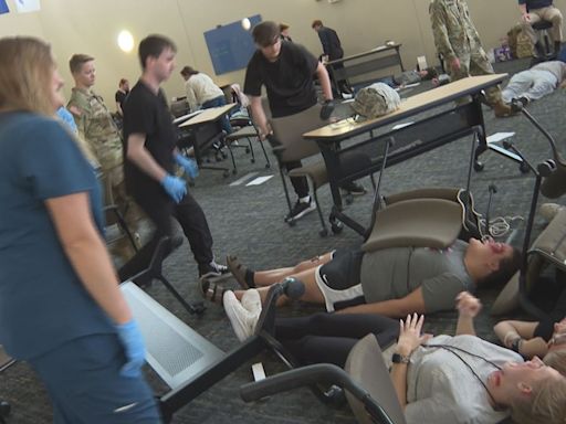 Students train in mock disaster training provided by Michigan National Army Guard