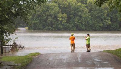 A dam fails after rain, wind and tornadoes pound the Midwest