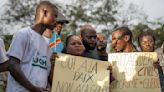 Families of the victims of attacks on displaced people in Congo mourn their dead