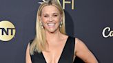 Reese Witherspoon wears plunging black dress and flashes her curves