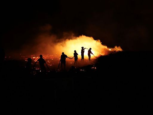 Three firefighters die as Portugal battles dozens of wildfires