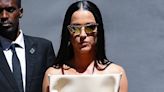 Katy Perry models striking cream dress with folded sides in NYC