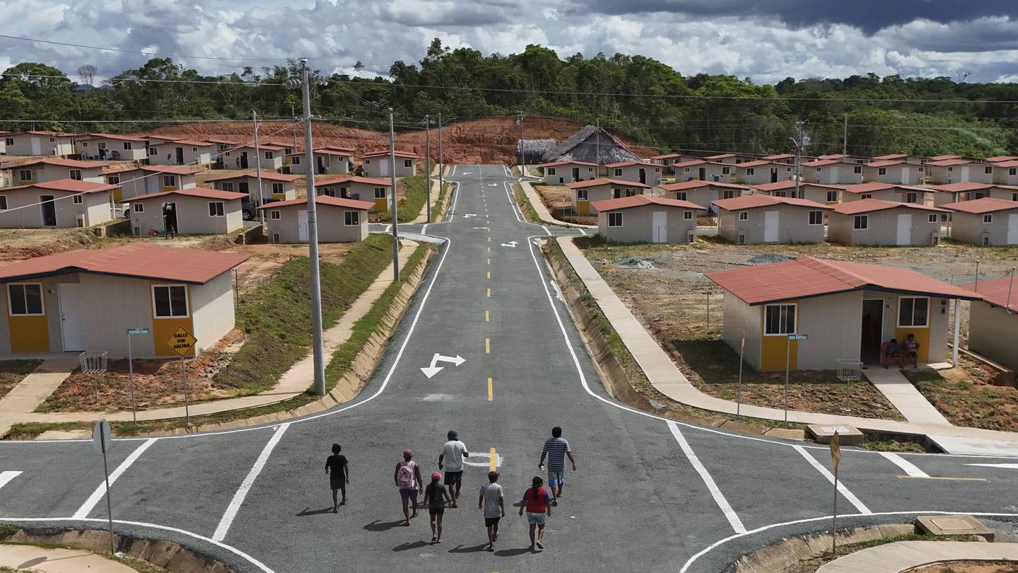 Panama community pushed from Caribbean island by rising sea levels moves into new houses