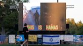 Screens playing loop of Hamas Oct. 7 attacks erected facing campus protests