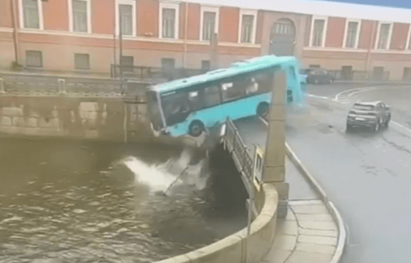 Video: Passenger bus drives over bridge, into river in Russia