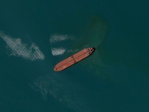 Iranian warship Sahand capsizes and sinks in port