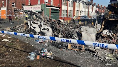 ‘I haven’t seen anything like this here’: Police car flipped and vehicles set alight as unrest breaks out in Leeds