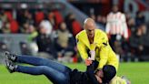 Soccer-UEFA opens probe after Sevilla keeper attacked by fan on pitch