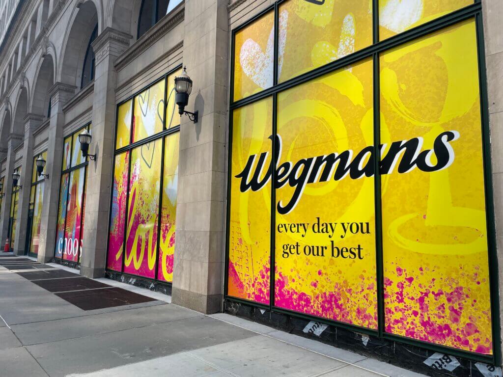 Wegmans teases third NYC store with new window signs