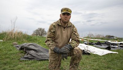 On Ukraine’s battlefields, this group respects fallen soldiers – no matter which side