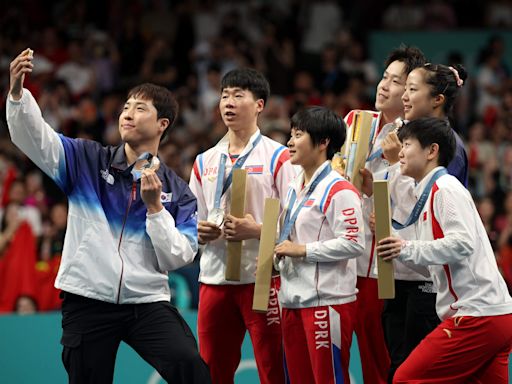 North and South Korea table tennis Olympic medalists pose for shared selfie