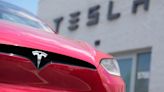 Tesla's stock leaps on reports of Chinese approval for the company's driving software