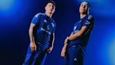 Manchester United unveil 90s-inspired dark blue away kit