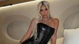 Kim Kardashian Strikes a Pose in Leather Set on Bed in Her Private Jet — Yes, There's a Corset