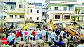 Residents protest as VMC razes shops | Vadodara News - Times of India