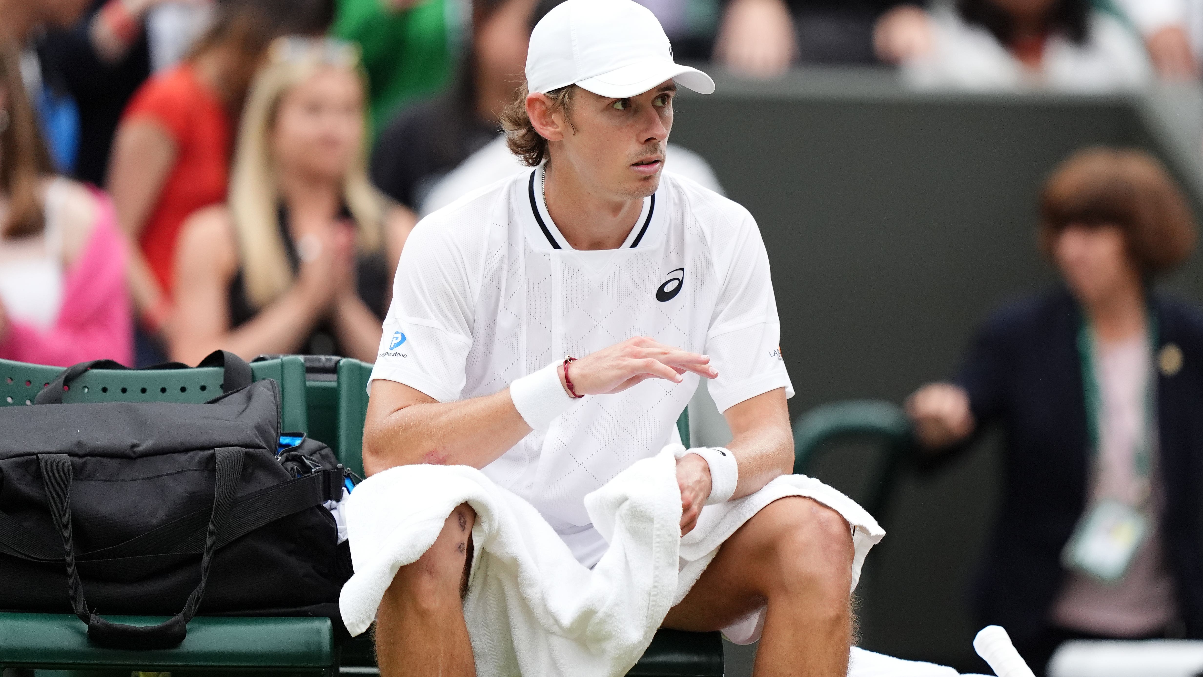 Alex De Minaur reaches first Wimbledon quarter-final but suffers injury scare