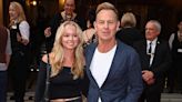 Jason Donovan cuts a smart casual figure in a navy blazer