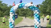 People walk at Genesee Valley Park to help support Golisano's Children's Hospital