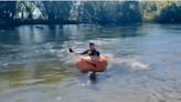 Watch: Man paddles river in Australia's largest pumpkin