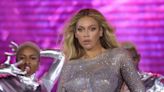 Beyoncé Wears Sequinned Gold Minidress With Feathered Cuffs and Torso Cut Out