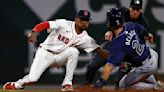 ... infielder Ceddanne Rafaela, left, tags out the Tampa Bay Rays' Jonny DeLuca at second base during the fifth inning at Fenway Park on Tuesday, May 14, 2024...