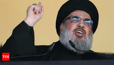 Shots in the air, wails and disbelief in Beirut after Hezbollah head killed - Times of India