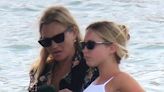 Kate Moss takes a water taxi to Ibiza with lookalike daughter Lila