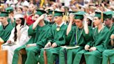 Graduates move their tassels