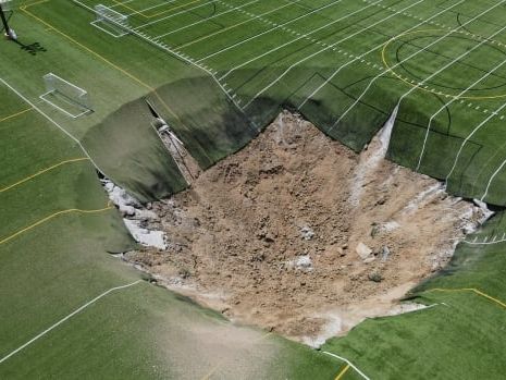 Giant sinkhole swallows part of Illinois soccer field where children often play | CBC News