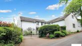 Coach house with quirky history and abundance of land on market