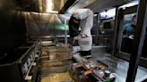Opinion: How robots making your burger and fries can lead to greater income inequality