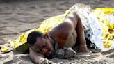 Exhausted migrants arrive on beach in Spain's Canaries