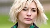 Jodie Whittaker cuts a forlorn figure while toting Woolworths bags