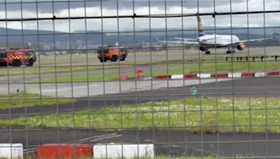 Plane tyre 'smokes' on Glasgow Airport runway as fire crews rush to scene