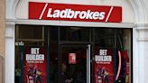 Ladbrokes owner Entain warns on online gaming revenue, shares slide