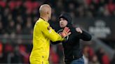 PSV fan punches Sevilla goalkeeper Marko Dmitrović, who instantly takes him down