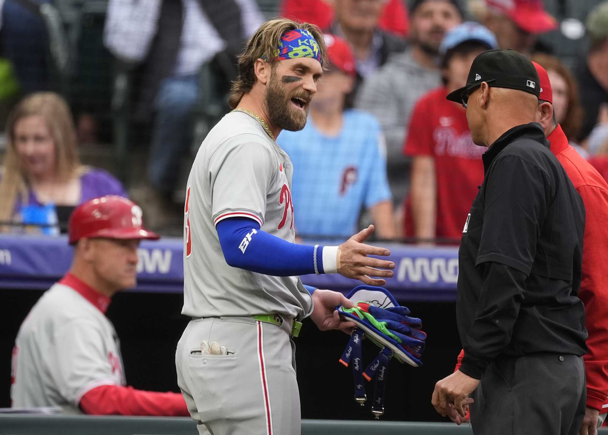 Rockies beat Phillies 3-2 in 11 innings after Philadelphia star Bryce Harper ejected in 1st