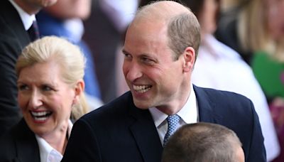 Prince William and equerry react to cheeky royal sign at Switzerland match