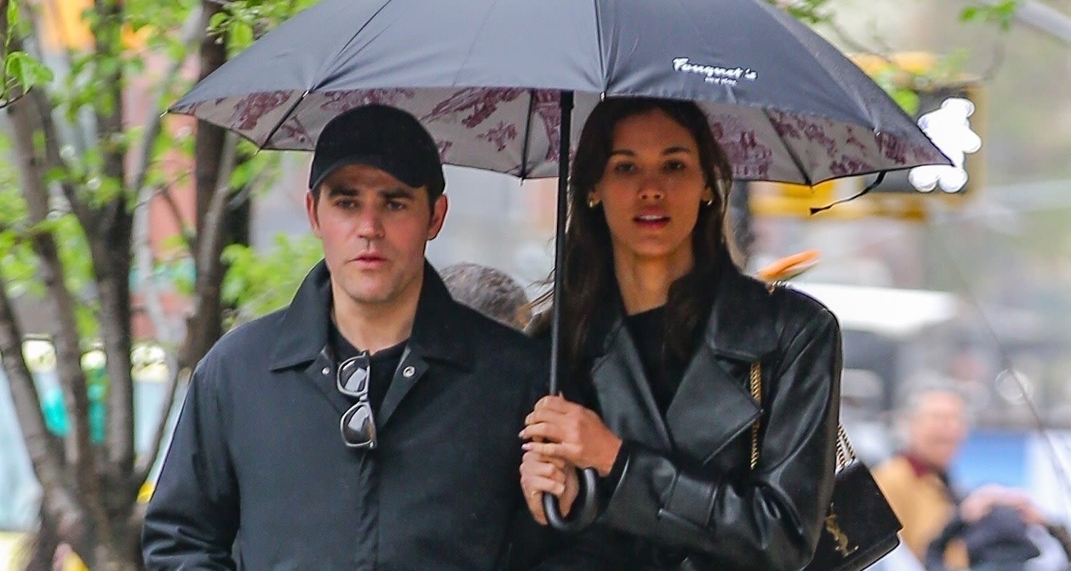 Paul Wesley & Girlfriend Natalie Kuckenburg Share an Umbrella During Rainy Day Outing