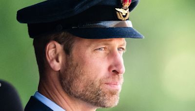 Prince William supported by his aunt Lady Sarah McCorquodale at military ceremony