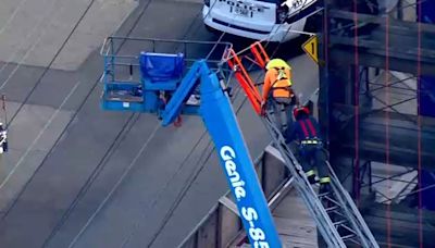Crews rescue worker in cherry picker trapped in power lines in Lynbrook | VIDEO