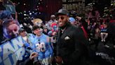 JC Latham celebrates becoming a Tennessee Titan with fans at 2024 NFL draft