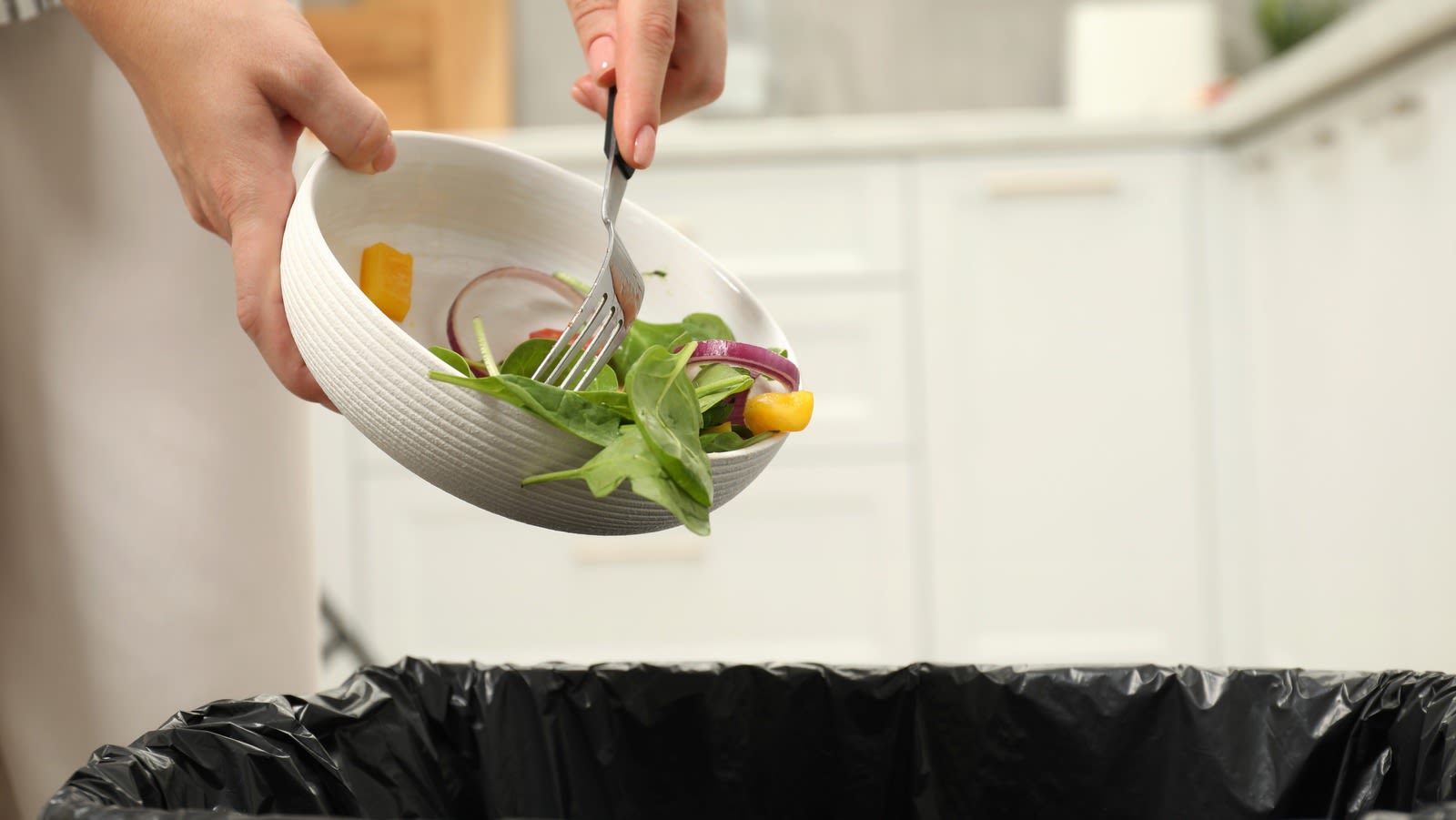 The Simple Hook Hack That Makes Kitchen Garbage Duty So Much Easier