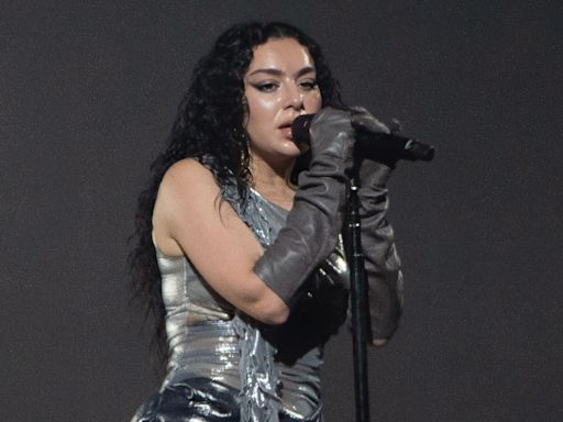 Charli XCX Layers Up in Tonal Silver Minidress With Futuristic Twists for Roskilde Festival 2024 Performance in Custom Rafaela Pestritu