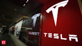 Tesla reports profit drop on price cuts, lower vehicle sales - The Economic Times