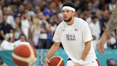 Devin Booker Had Awesome Gift for Fan in Paris Wearing His Phoenix Suns Jersey