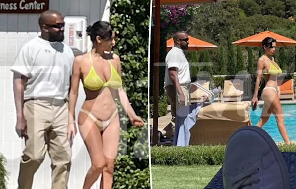 Bianca Censori steps out in a tiny bikini as Kanye West remains fully dressed at luxurious hotel outing in California