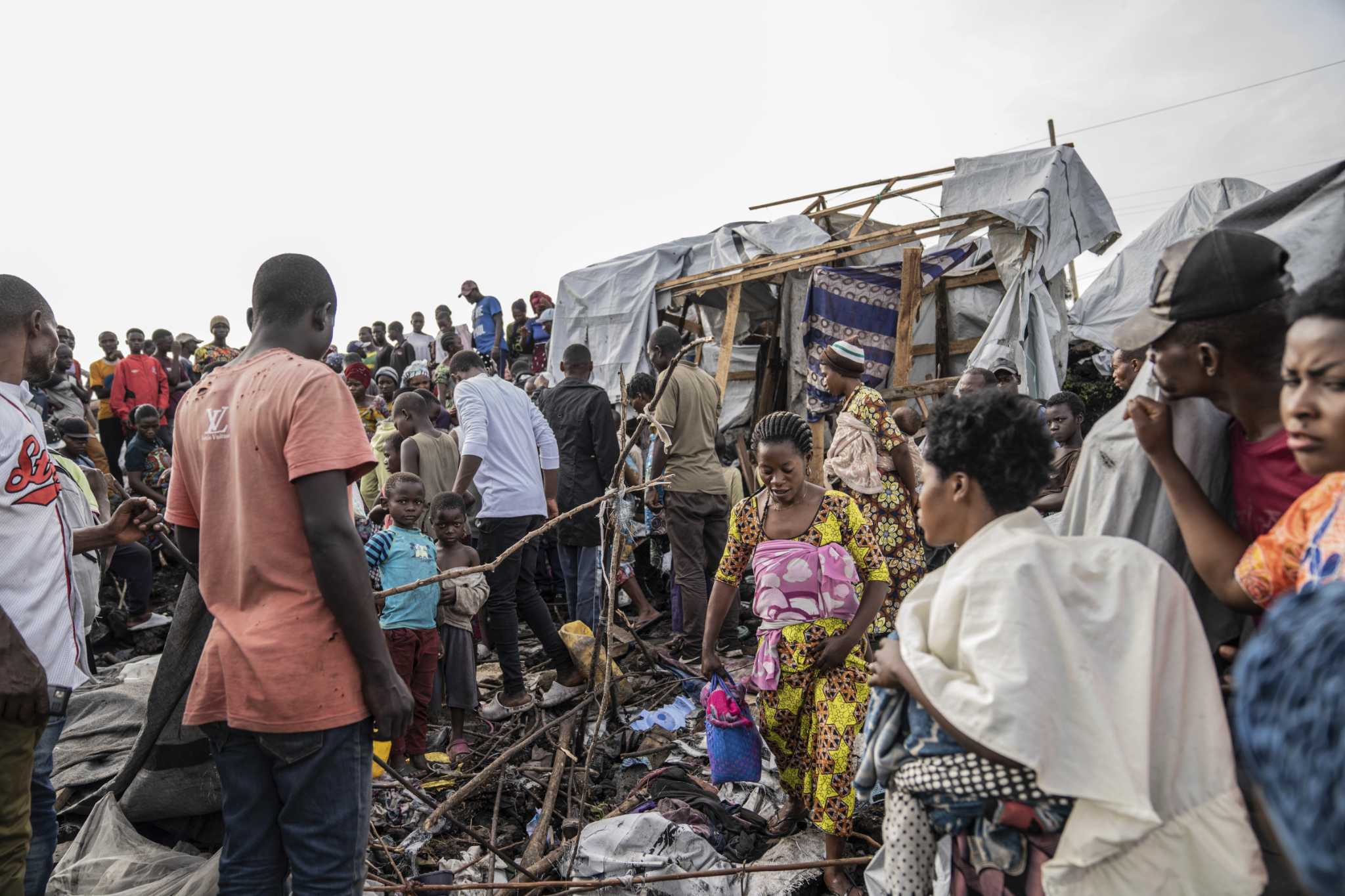 Bomb kills at least 12 people, including children, at two displacement camps in eastern Congo