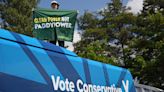 Climate protester climbs Conservative ‘battle bus’ ahead of James Cleverly campaign visit