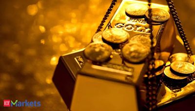 Gold flat as dollar, yields firm; investors seek more US data